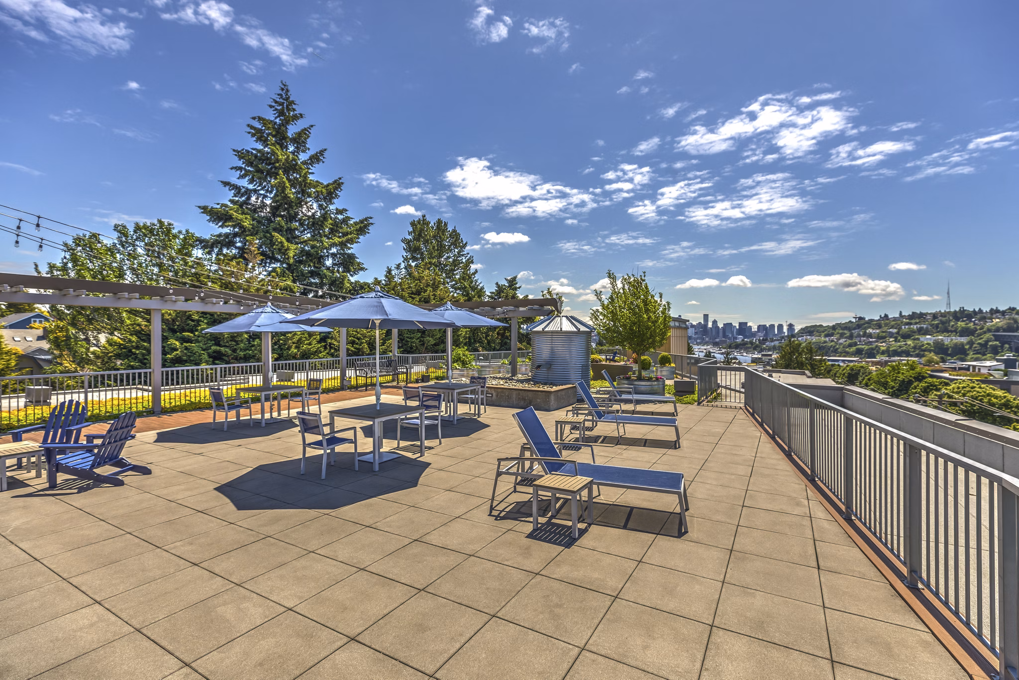 Relaxing patio area with outdoor seating at Prescott Apartments, offering modern luxury living spaces