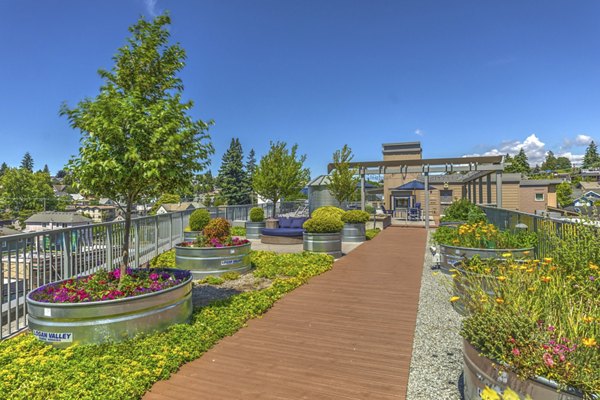 Patio area with seating and fire pit at Prescott Apartments, a Greystar luxury community