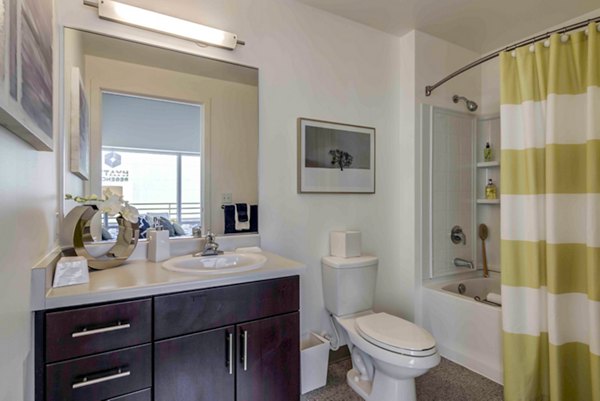Aspira Apartments: Modern bathroom featuring sleek fixtures and marble countertops