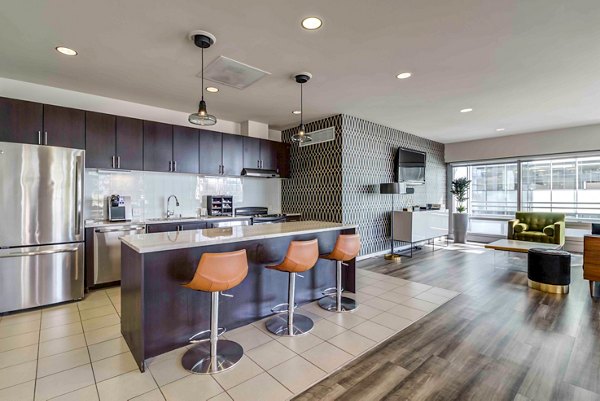 Clubhouse with modern amenities at Aspira Apartments, featuring comfortable seating and communal spaces for residents in downtown Seattle