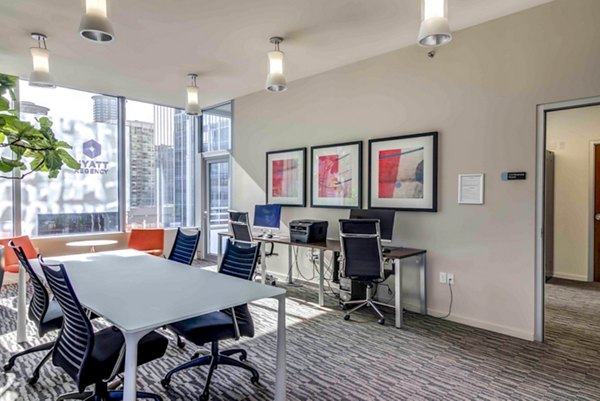 Business center with modern workstations at Aspira Apartments