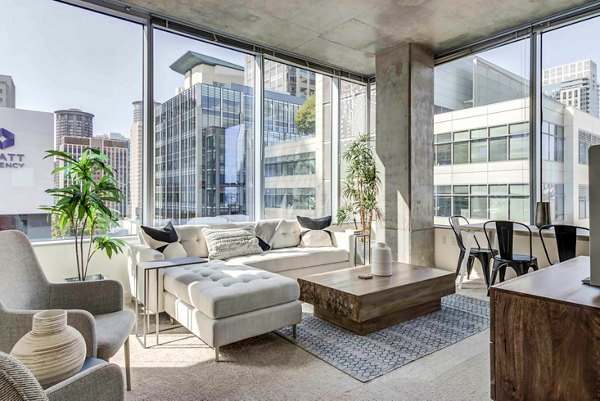 Spacious living room with modern furnishings and ample natural light in Aspira Apartments, Seattle luxury apartments