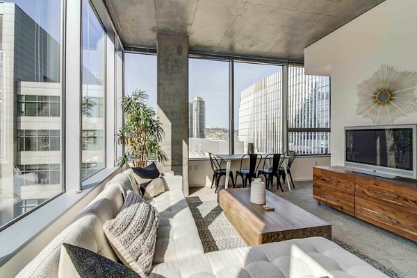 Stylish living room with modern furnishings at Aspira Apartments, a Greystar luxury property in a vibrant urban setting