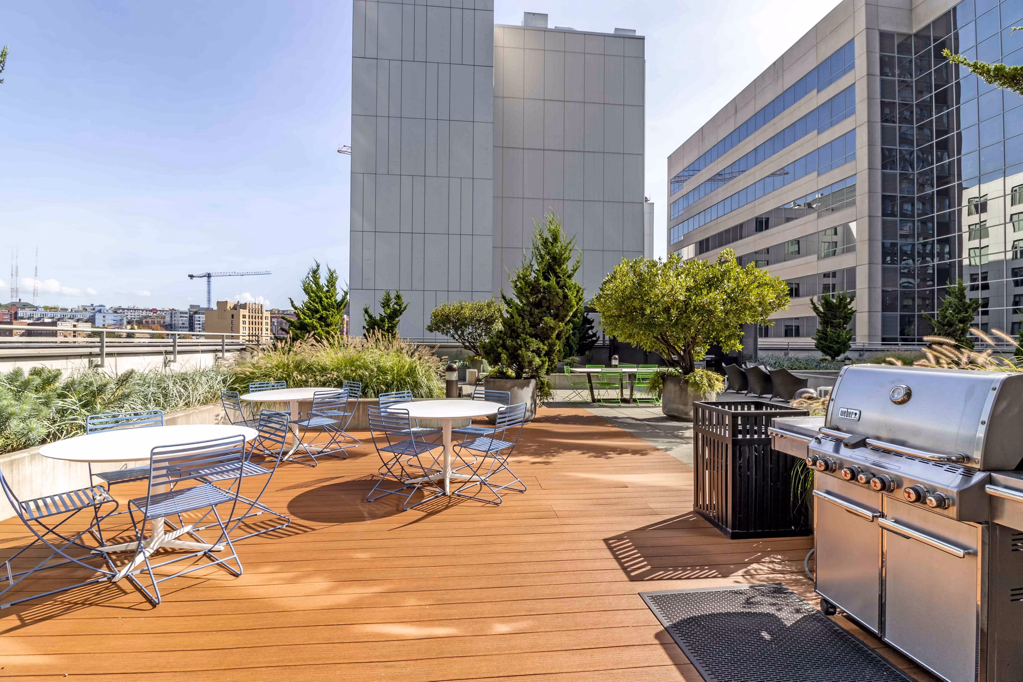 Outdoor grill area featuring modern barbecue stations at Aspira Apartments in downtown Seattle Perfect for outdoor gatherings and entertainment