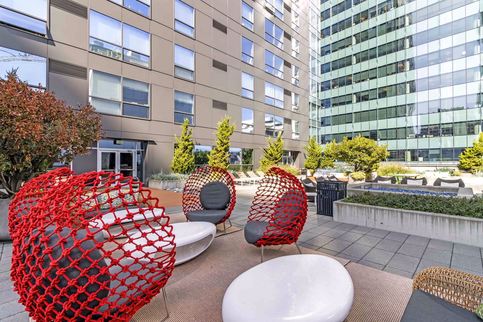Courtyard at Aspira Apartments featuring modern landscaping and comfortable seating in downtown Seattle