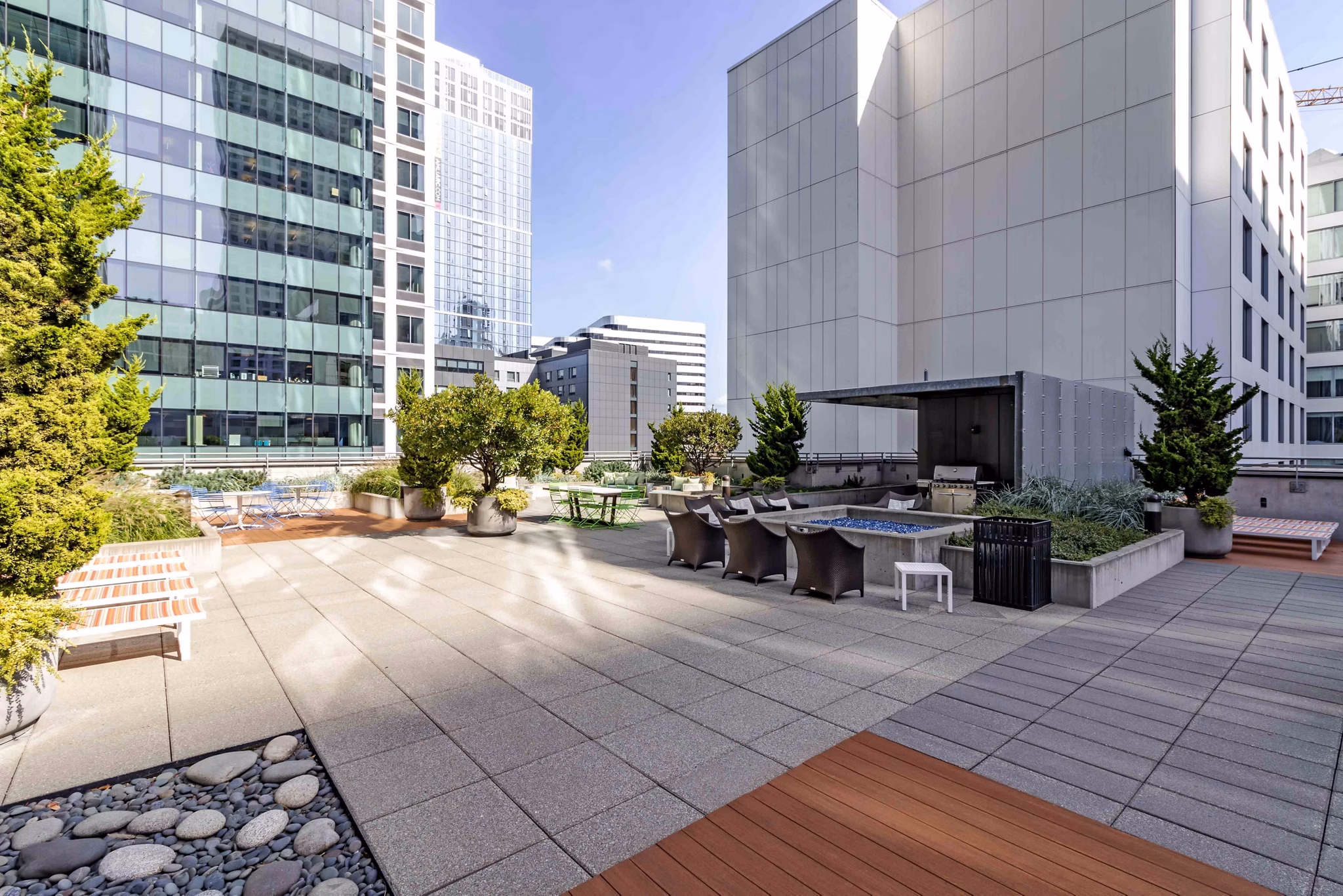 Courtyard featuring lush landscaping and seating areas at Aspira Apartments