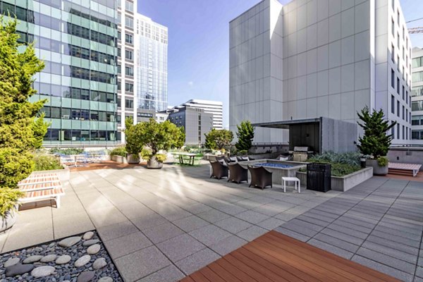 Courtyard featuring lush landscaping and seating areas at Aspira Apartments