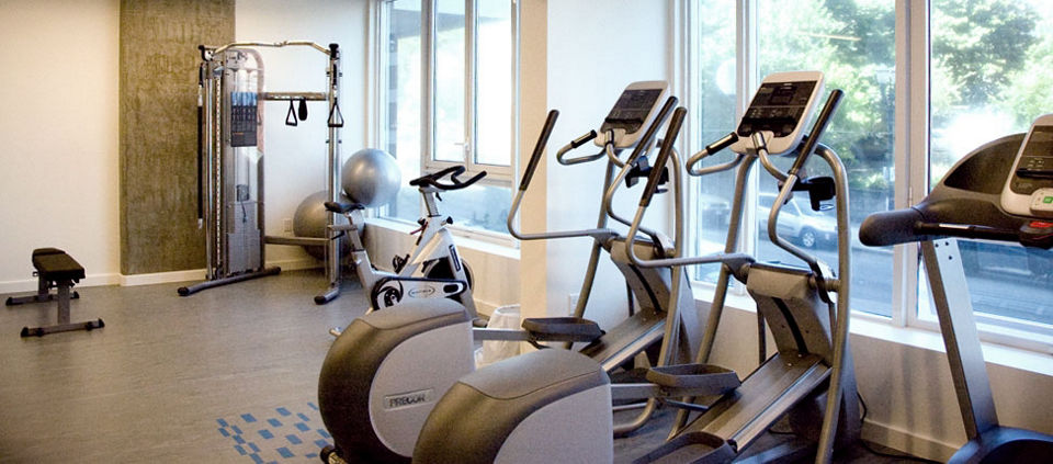 Modern fitness center with state-of-the-art equipment at Cyan PDX Apartments