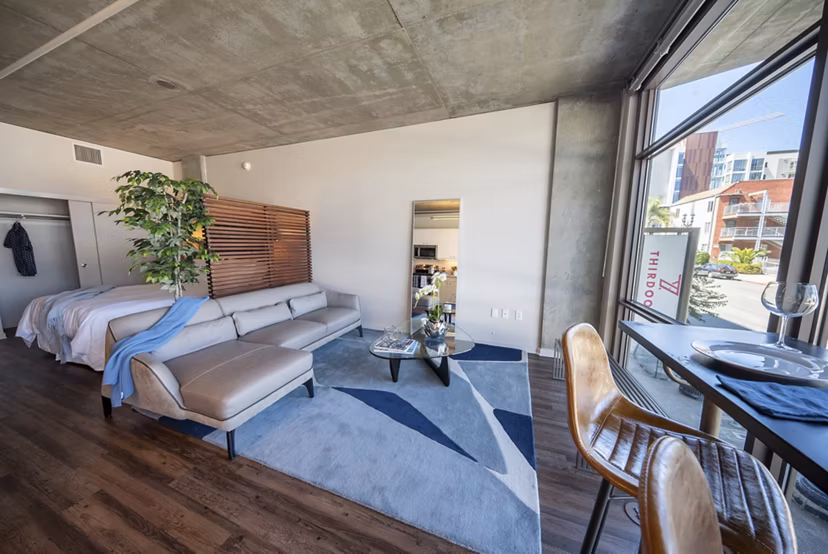 Grill area with modern seating and barbecue facilities at Tenth&G Apartments