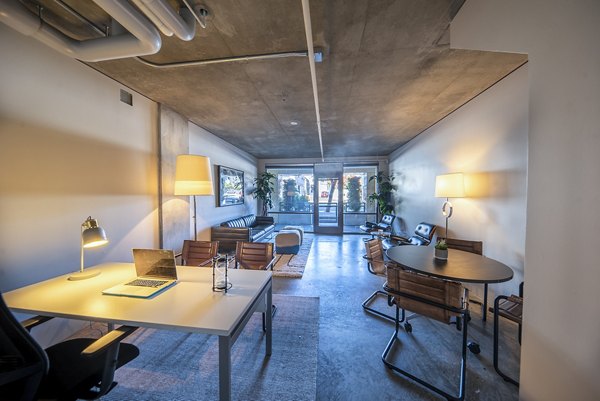 Modern business center with ergonomic workstations at Tenth&G Apartments