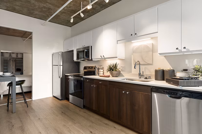 Modern kitchen with stainless steel appliances at Tenth&G Apartments