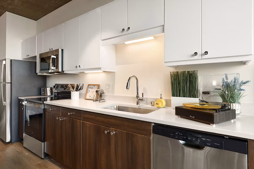 Modern kitchen with high-end appliances in Tenth&G Apartments