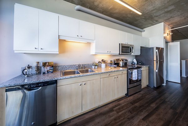 Modern kitchen with high-end appliances in Tenth&G Apartments