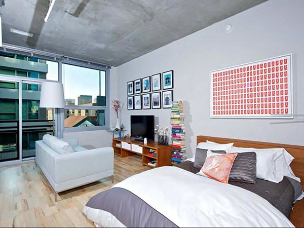 Elegant living room with contemporary design and natural light at Tenth&G Apartments, Greystar luxury apartments in urban setting