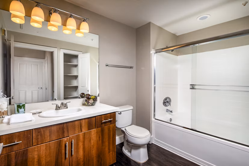 Modern bathroom with sleek fixtures at Avila at Rancho Santa Margarita Apartments, featuring elegant design and ample lighting