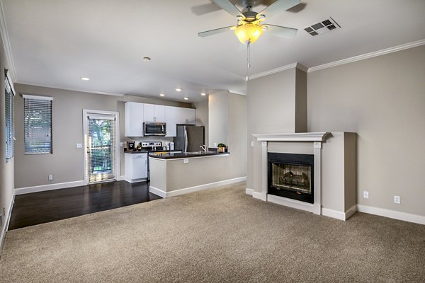 Spacious living room with modern furnishings at Avila at Rancho Santa Margarita Apartments