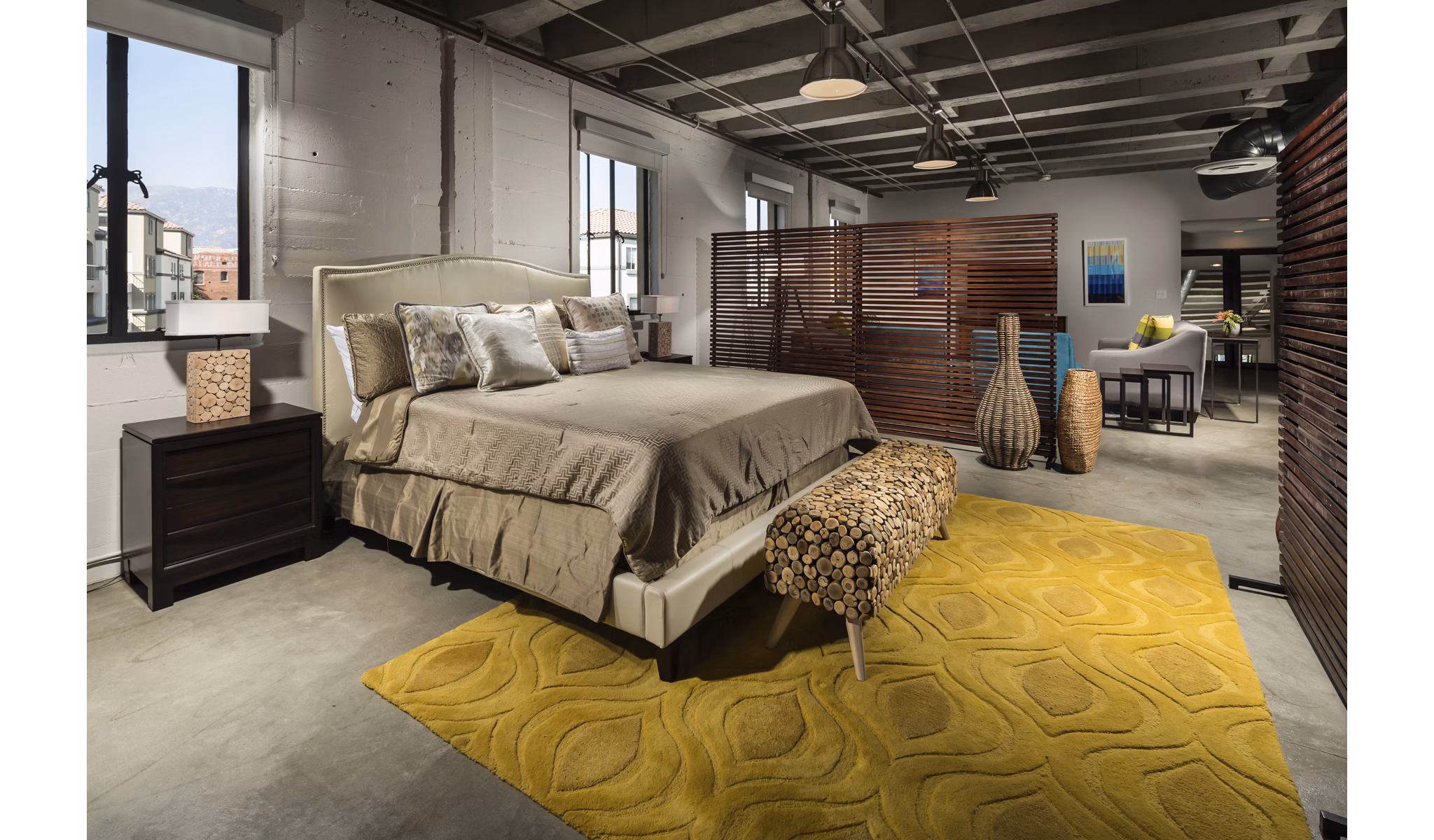 Cozy bedroom with modern decor at Holly Street Village Apartments, showcasing luxury living