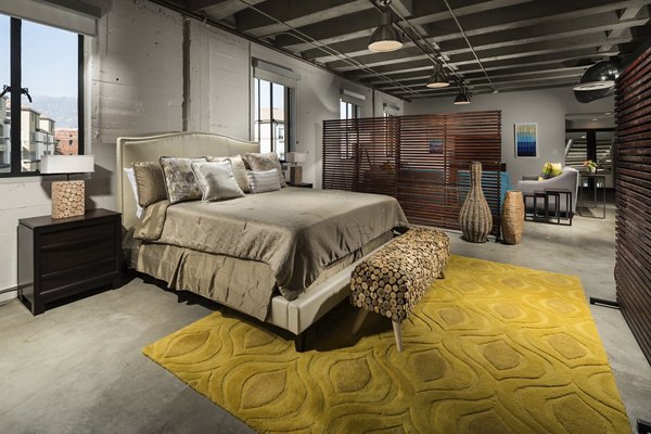 Cozy bedroom with modern decor at Holly Street Village Apartments, showcasing luxury living