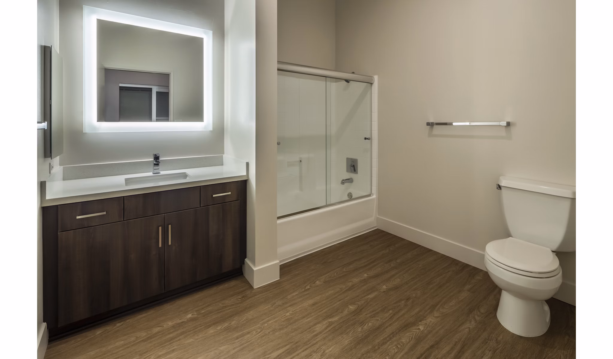 Bathroom featuring modern fixtures and white tiles at Holly Street Village Apartments
