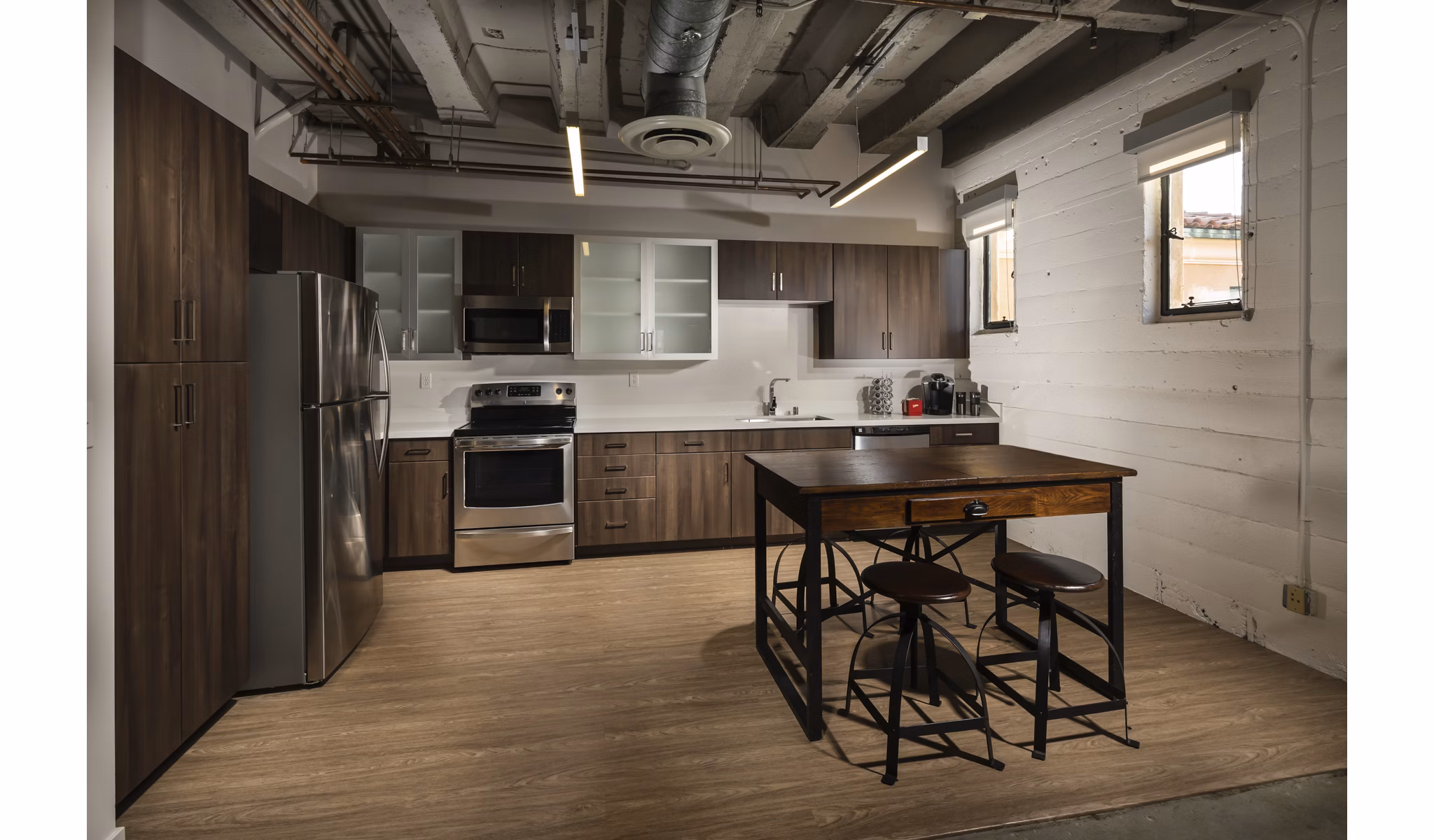 Modern kitchen with stainless steel appliances at Holly Street Village Apartments