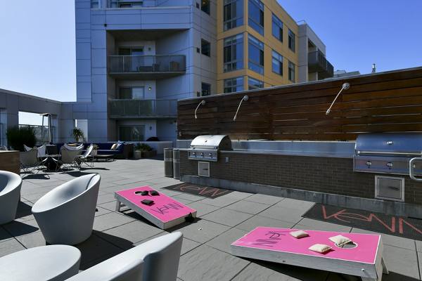 grill area and recreational games at Venn Apartments