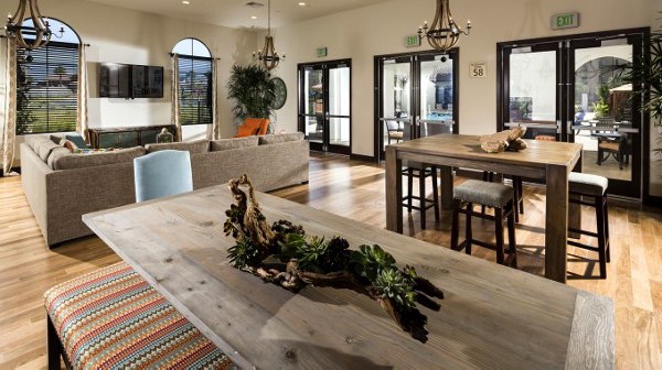 Elegant clubhouse with modern decor at Montecito at Dos Lagos Apartments, featuring spacious lounging areas and a billiards table