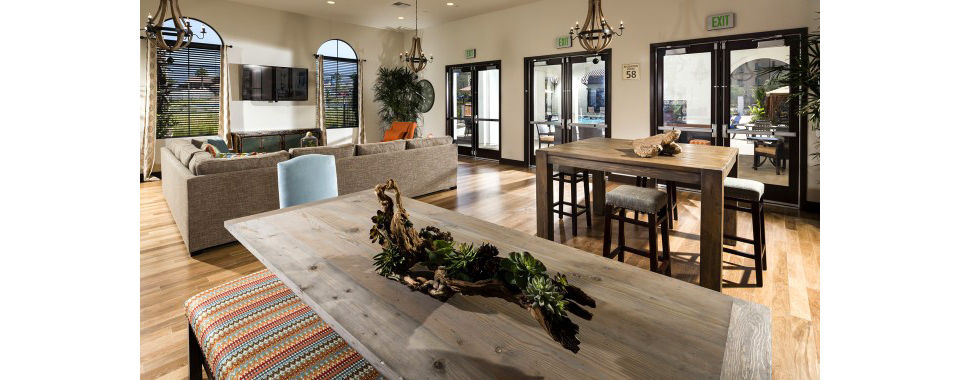 Elegant clubhouse with modern decor at Montecito at Dos Lagos Apartments, featuring spacious lounging areas and a billiards table