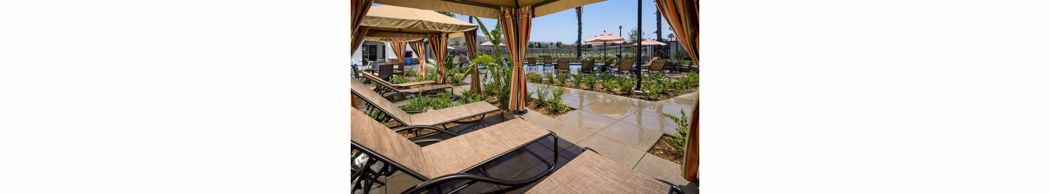 Spacious patio with outdoor seating at Montecito at Dos Lagos Apartments featuring luxury amenities