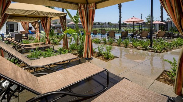 Spacious patio with outdoor seating at Montecito at Dos Lagos Apartments featuring luxury amenities