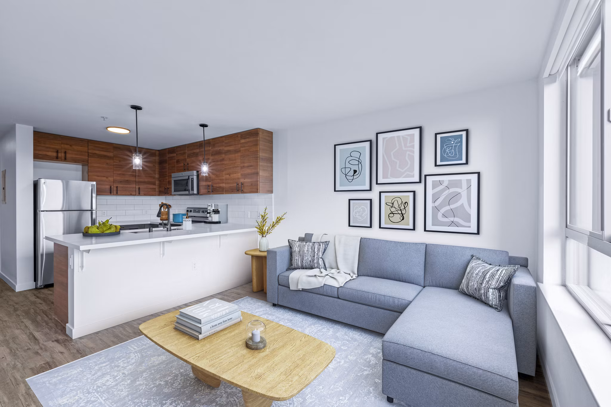 Spacious living room with modern decor in The Station at Othello Park Apartments