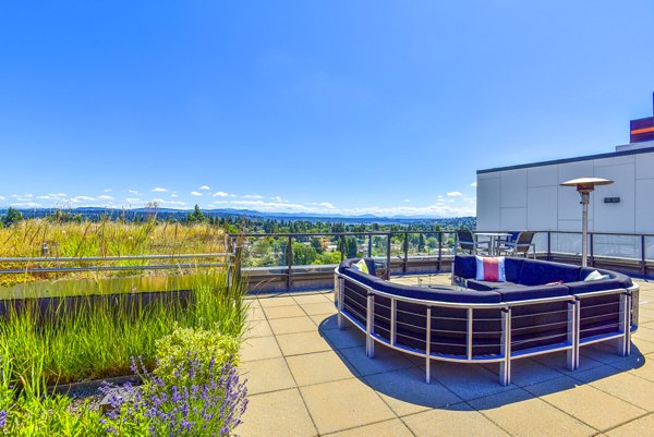 Modern patio with cozy seating at The Station at Othello Park Apartments, ideal for relaxation and social gatherings