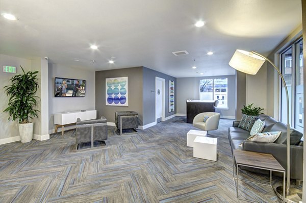 Clubhouse featuring modern design and comfortable seating at Harrington Square Apartments, a Greystar luxury community