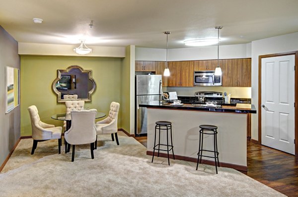 Dining room featuring elegant decor and modern lighting at Harrington Square Apartments