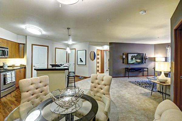 Dining room with elegant table setting at Harrington Square Apartments