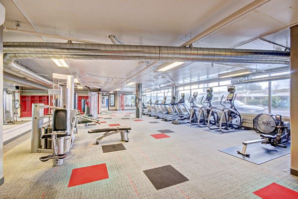 State-of-the-art fitness center in Harrington Square Apartments with modern equipment and spacious workout areas for an enhanced fitness experience