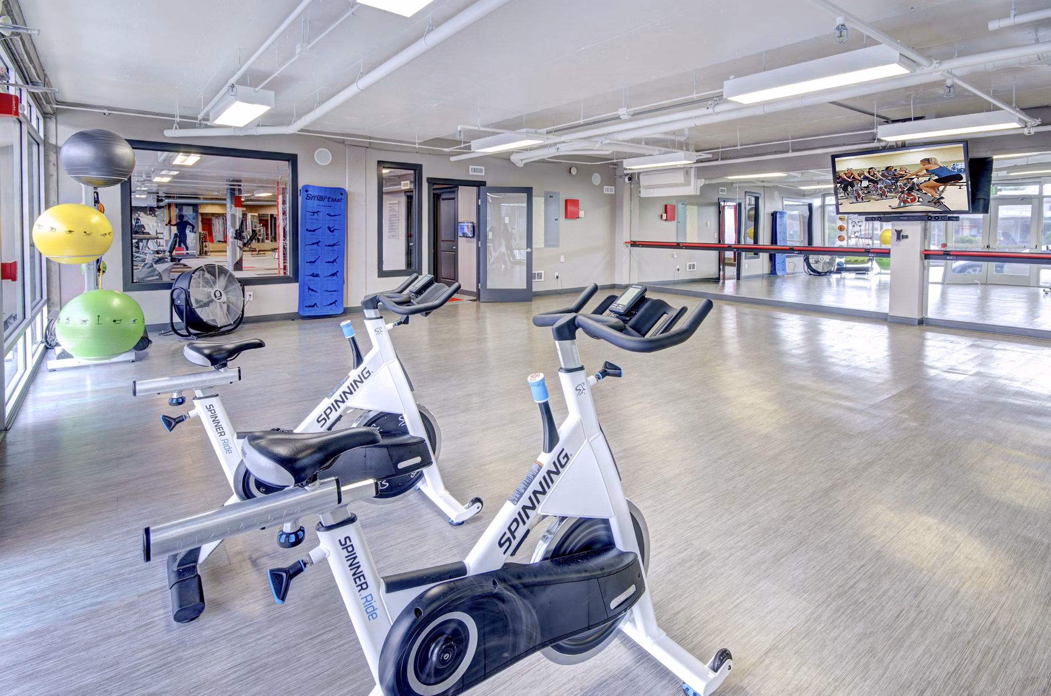 Harrington Square Apartments: State-of-the-art fitness center with modern equipment for residents' wellness journey