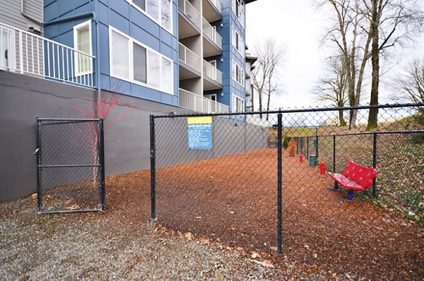 Children's playground with modern equipment at Harrington Square Apartments, promoting a family-friendly environment