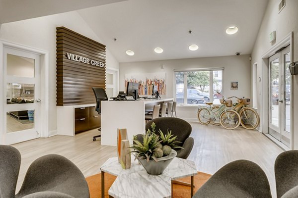 Clubhouse view featuring elegant lounge area at Village Creek at Brookhill Apartments in Charlotte