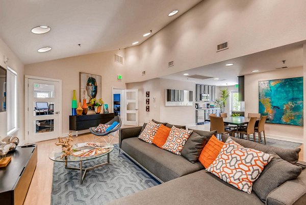 The Eva Apartments: Contemporary clubhouse with stylish furnishings and ample seating, offering a social hub in downtown living