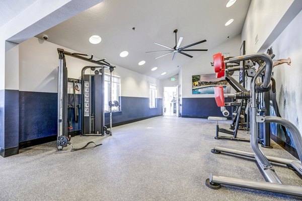 Modern fitness center with state-of-the-art equipment at Village Creek at Brookhill Apartments