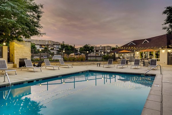 Resort-style pool at Village Creek at Brookhill Apartments offering luxury relaxation space