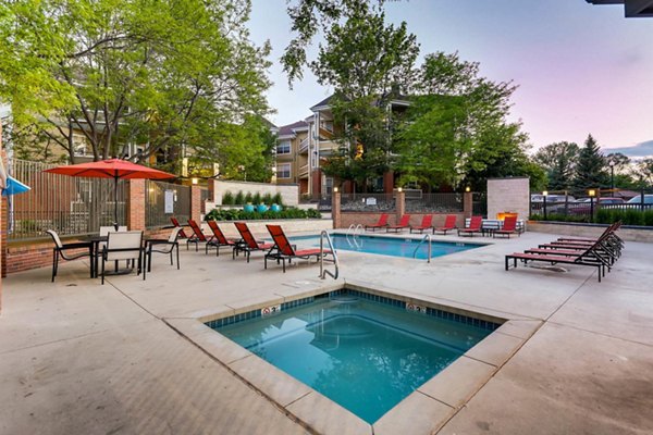 Relaxing poolside oasis at The Eva Apartments offering luxury amenities and modern design