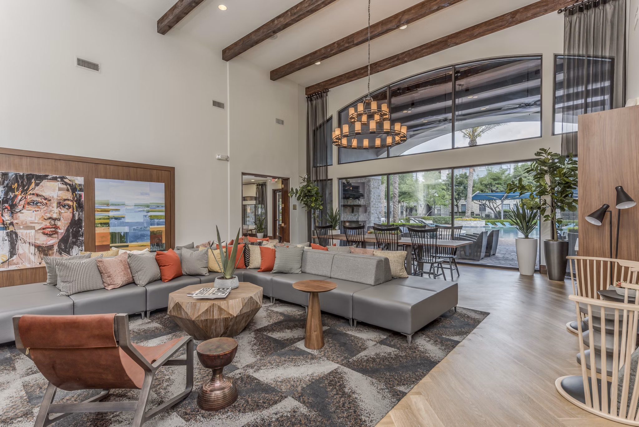 Clubhouse with modern furnishings and lounge areas at Deseo at Grand Mission Apartments in Richmond, ideal for socializing and relaxation