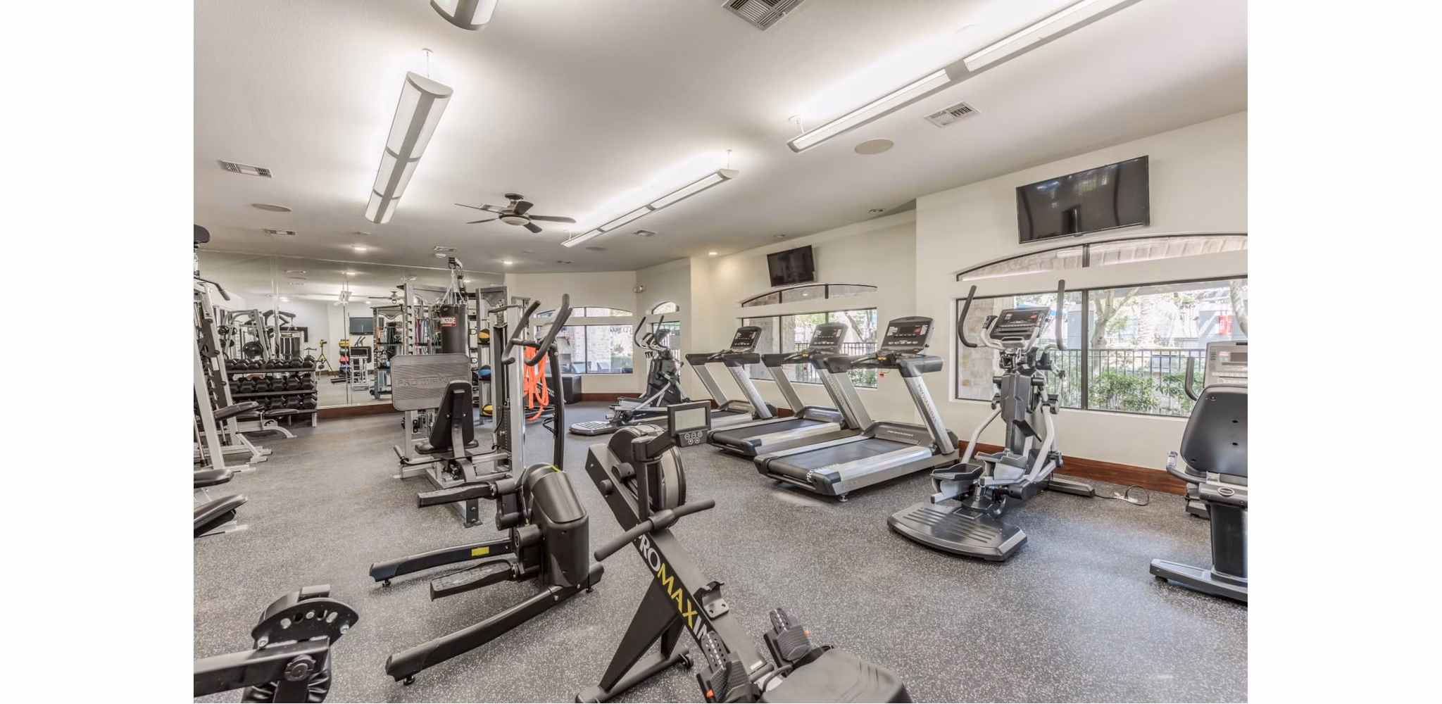 fitness center at Deseo at Grand Mission Apartments