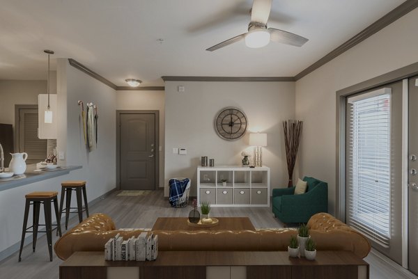 Inviting living room with contemporary decor in Deseo at Grand Mission Apartments, ideal for luxury living