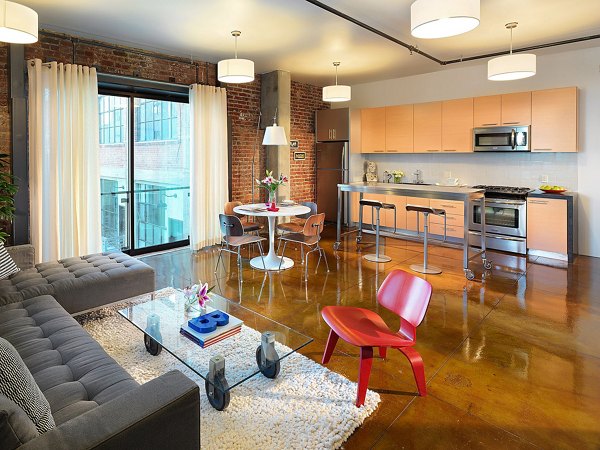 Dining area featuring modern fixtures and sleek furniture in Arc Light Apartments