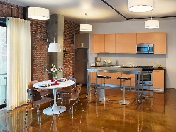 Modern dining room with sleek furniture at Arc Light Apartments, a luxury community by Greystar in the heart of the city