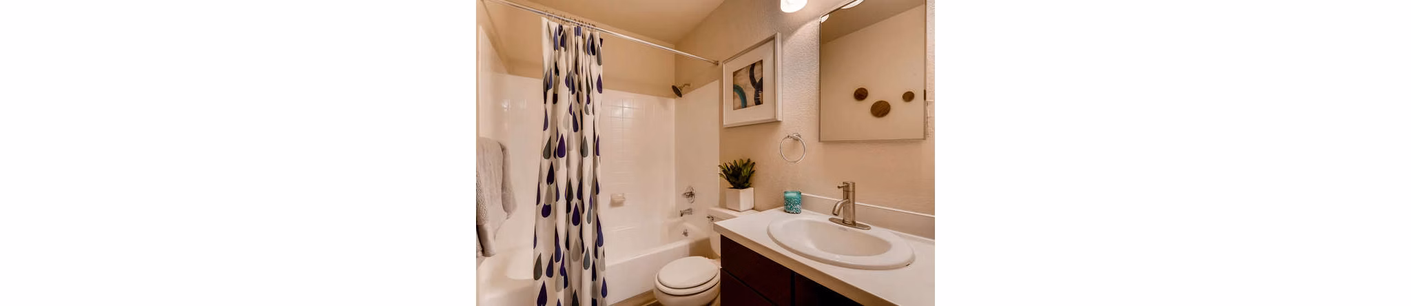 Modern bathroom featuring sleek fixtures and marble countertops in Lakeview Towers at Belmar Apartments