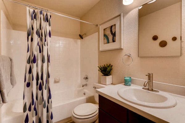 Modern bathroom featuring sleek fixtures and marble countertops in Lakeview Towers at Belmar Apartments