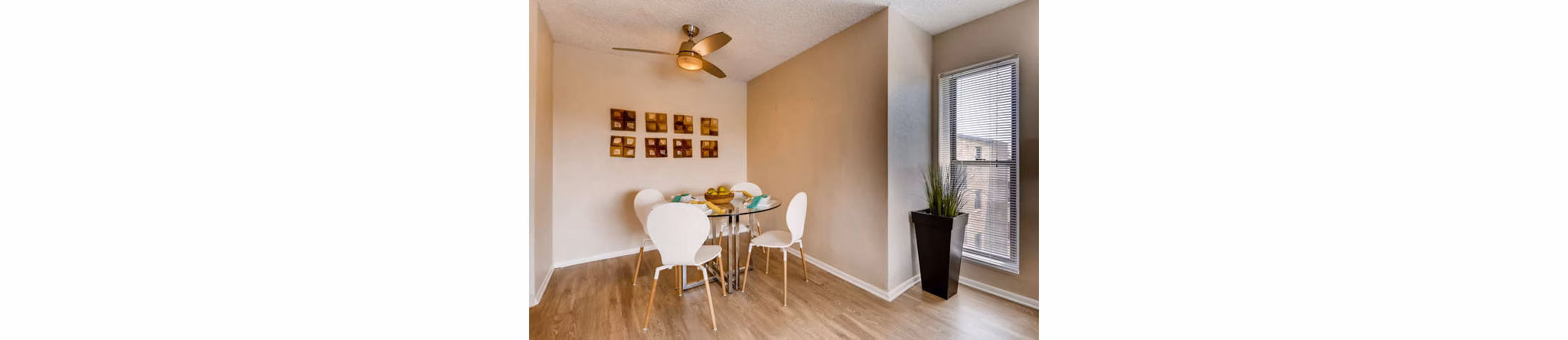 Dining room with modern decor and elegant lighting in Lakeview Towers at Belmar Apartments, luxury living
